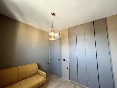 a living room with a couch and a closet at STAY Mouson View Apartment in Limassol