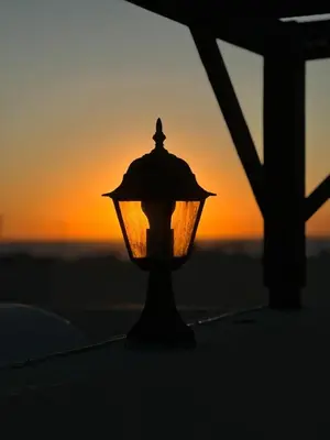 a street light with the sunset in the background at Esentepe Turtle Bay Village - The Boho Breeze Holiday Home in Aglantzia