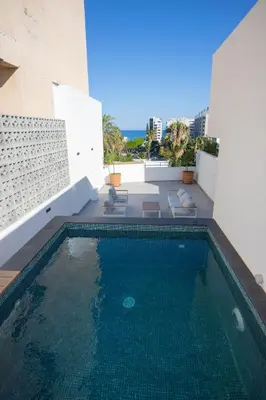 a swimming pool on the roof of a building at Bridge House 202-2BR Modern Apartment in Limassol