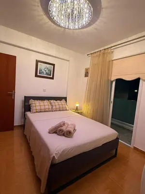 a bedroom with a bed with two towels on it at Margarita Luxury 3 Bed & Pool in Dherinia