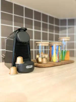 a toaster sitting on top of a counter with spices at Sunny Pyla Escape with Pool, Tennis & Fast Wi-Fi in Pyla