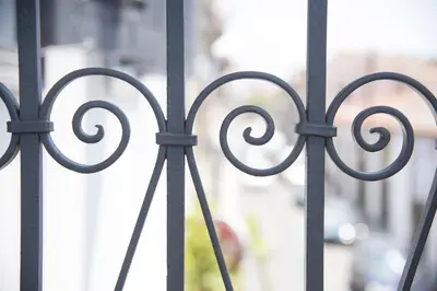 a black metal gate with a view of a street at Lokàl Boutique Hotel in Larnaka