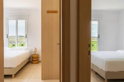 a bedroom with two beds and a window at 2BR Apartment with Amazing View and Pool in Kiti in Kiti