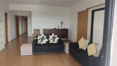 a living room with two couches and a table at Poseidon 502 penthouse in Larnaka