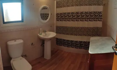 a bathroom with a toilet and a sink at Poseidon 502 penthouse in Larnaka