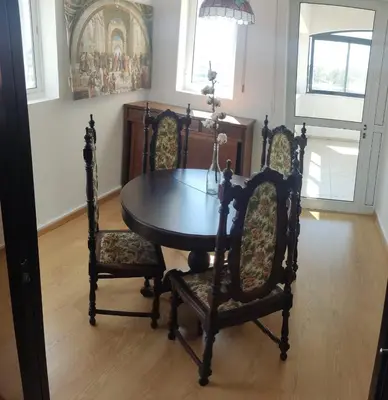 a dining room with a table and two chairs at Poseidon 502 penthouse in Larnaka