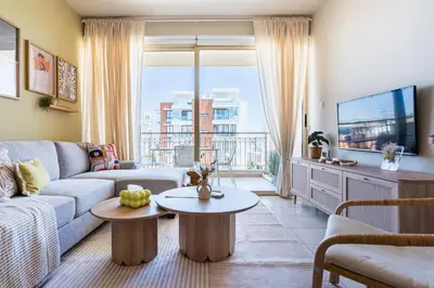 a living room with a couch and a table at Mystique 1-Bedroom Apartment in Larnaka