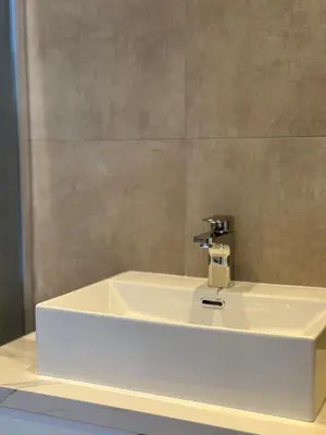 a white sink in a bathroom with a mirror at Aqua Beachfront Villas - Villa 2 in Ayia Napa