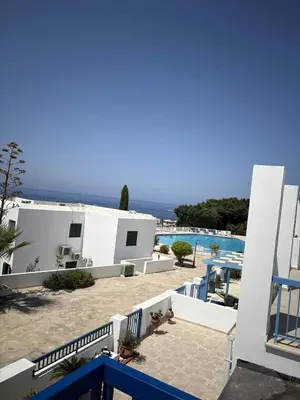 a view of a resort with a swimming pool at Ikaria Village, Maisonette Sea 10 in Aglantzia