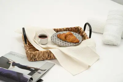 a table with a plate of bread and a cup of coffee at Central 2 bedroom flat in Nicosia