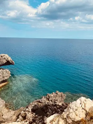 a view of the ocean from the top of a cliff at Serenity Apartment with Pool in Paralimni