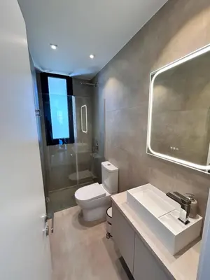 a bathroom with a toilet and a sink and a mirror at Luxury Elegant Home in Protaras