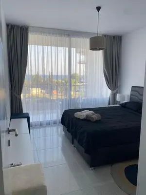 a bedroom with a bed and a large window at Northern Cyprus Iskele Bogaz Abelia One plus One Sea View in Boğaz