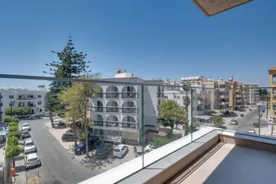 an apartment with a view of a street at Oniro Suites Makenzy in Larnaka
