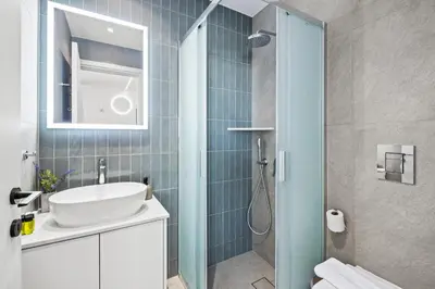 a bathroom with a sink and a shower at Artemis 206 - Seaside Stories in Livadhia