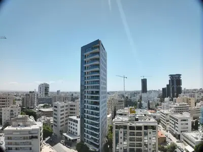 a view of a city with a tall building at SkyHigh Park View Living in Nicosia
