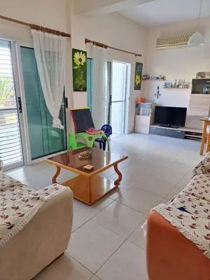 a living room with a couch and a coffee table at ισόγειο διαμέρισμα με αυλή στην περιοχή Κάππαρη κατάλληλο για οικογενεια in Paralimni