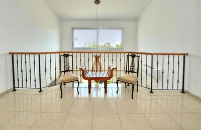 a room with a table and two chairs on a balcony at Villa Emilia in Ayia Napa