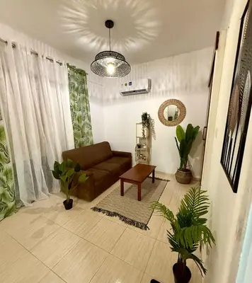 a living room with a couch and a table at Alison rooms in center in Larnaka