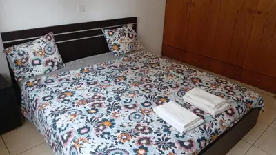 a bed with towels and pillows on it at Unique City room in Larnaka