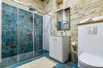 a bathroom with a shower and a sink at Kallistheni - Stylish Studio Apartments in Lefkara in Pano Lefkara