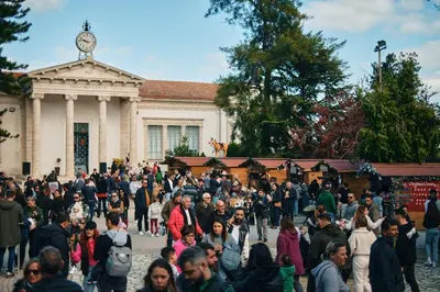 a crowd of people walking in front of a building at Kallistheni - Stylish Studio Apartments in Lefkara in Pano Lefkara
