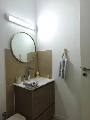 a bathroom with a sink and a mirror at Domus ArsEleAndra Studio-162 in Larnaka