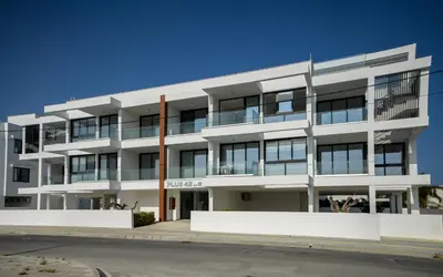 an apartment building on the side of a street at Sunny 1-Bedroom Apartment - StaysbyDais in Larnaka