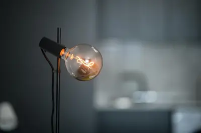 a light bulb on a pole with a microphone at Sunny 1-Bedroom Apartment - StaysbyDais in Larnaka