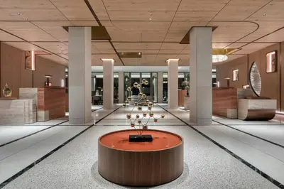 a lobby with a fountain in the middle of a building at The Landmark Nicosia, Autograph Collection in Nicosia