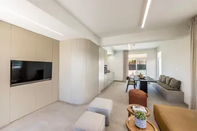 a living room with a couch and a table at Villa Mesogeios 4 in Protaras