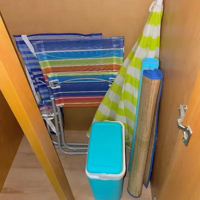 a door with a pile of towels and a towel rack at Comfortable Vacation House in Protaras