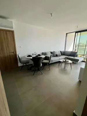 a living room with a couch and a table and chairs at Modern Designer Home in Larnaka
