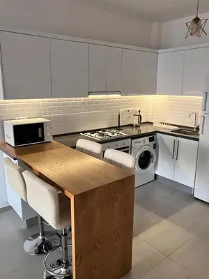 a kitchen with a counter and a stove top oven at Caesar Socrates Apartment in Larnaka