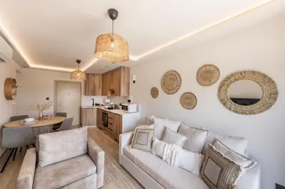 a living room with a couch and a table at Pallini 202 in Protaras
