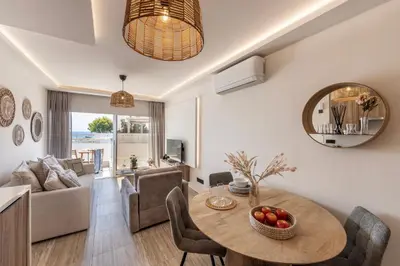 a living room with a table and a couch at Pallini 202 in Protaras