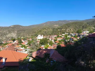 a view of a town with mountains in the background at Casa del Kampos in Kambos