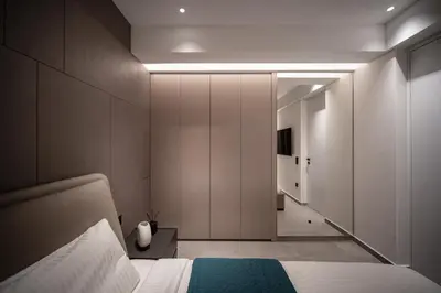 a bedroom with a bed and a hallway at Dest Retreat Beach & City Apt in Limassol