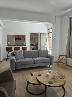 a living room with a couch and a table at Maryland Lodge hideaway in Kakopetria