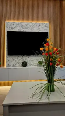a vase of flowers on a table in a room at Protaras Ayios Elias Maisonette in Protaras