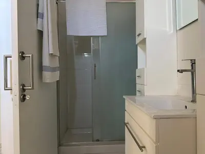 a bathroom with a shower and a sink at White House with Garden and BBQ in Strovolos in Nicosia