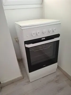 a white stove in a kitchen with a counter at Comfortable Ground Floor Studio in Limassol in Limassol