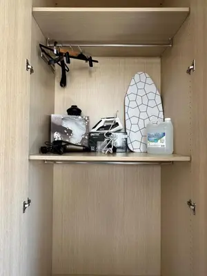 a shelf with cosmetics and other items on it at Majestic Gardens 10 minutes from Larnaka Airport in Tersephanou