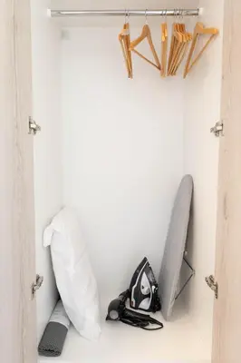 a closet with snowboards and ski equipment on the wall at Napa Heights in Ayia Napa