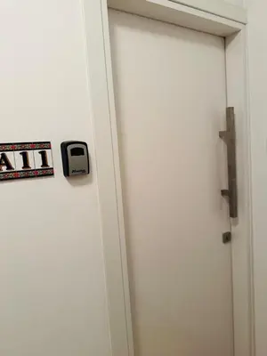 a white door with a door knob next to a door at Sunny Escape, Protaras, Cyprus in Protaras