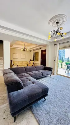 a large living room with couches and a couch at Alkeou Holiday Home in Limassol