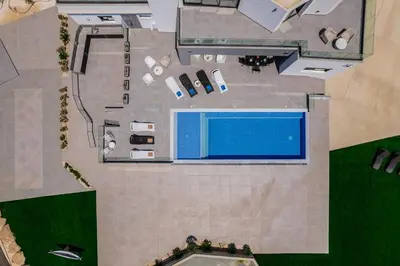 an overhead view of a swimming pool in a resort at Exclusive 7-Bdr Villa with Panoramic Views & Saltwater swimming pool! in Ayia Napa