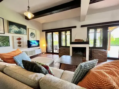 a living room with a couch and a fireplace at STAY Perla House in Protaras