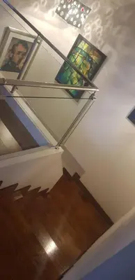 a staircase with stained glass windows on the ceiling at Live in landlord guest house panthea in Limassol