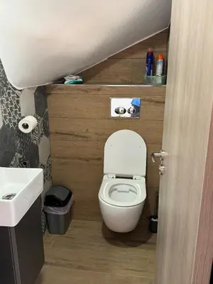 a small bathroom with a toilet and a sink at Great Escape -Holiday House in Larnaka